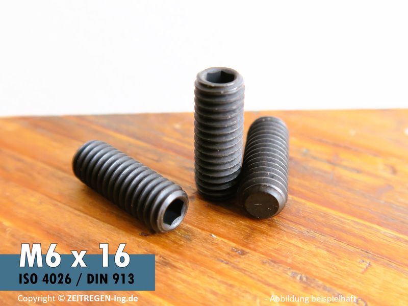 Schwarze Gewindestifte mit Innensechskant und Kegelkuppe auf Werkbank