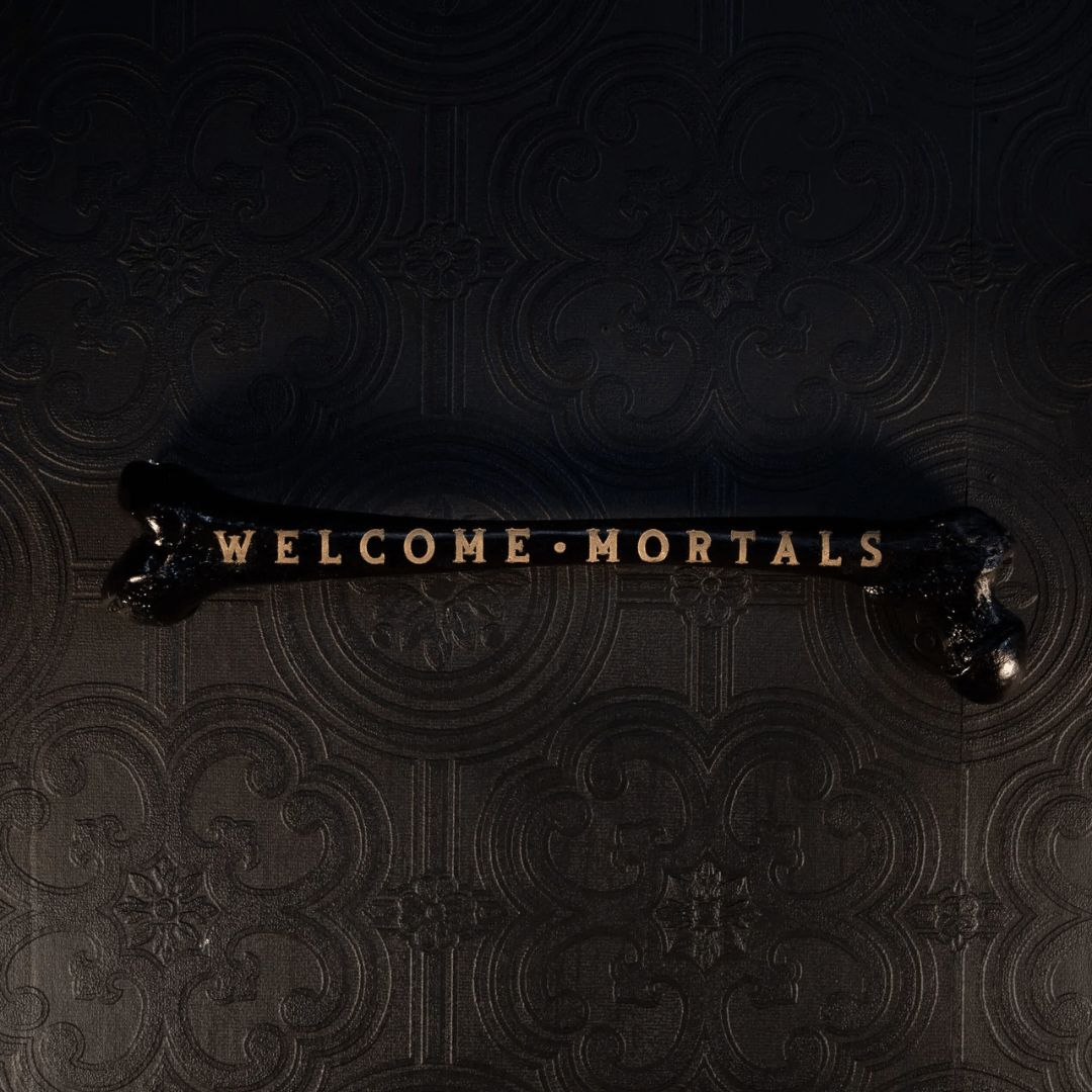 Welcome Mortals Engraved Femur | Black Bone, Gold Text