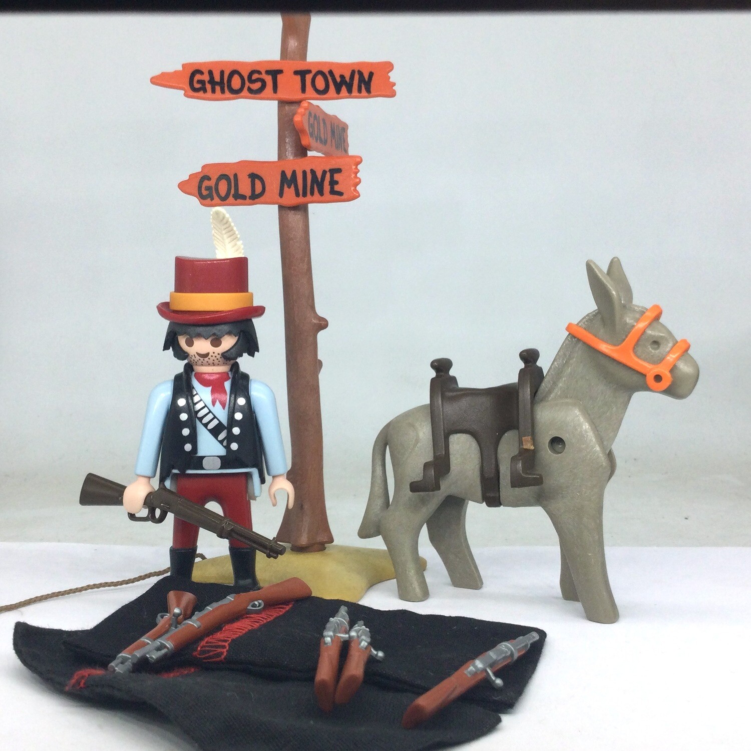 Playmobil cow boy marchand d'arme