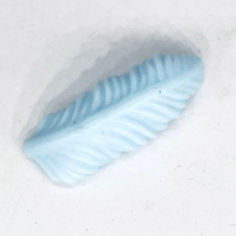 Playmobil plume bleu ciel allongée