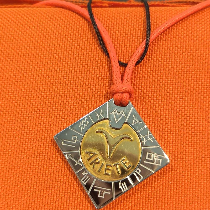 Collana in acciaio e oro 18 kt ariete - COMETE Collana in acciaio e oro 18 kt ariete - COMETE