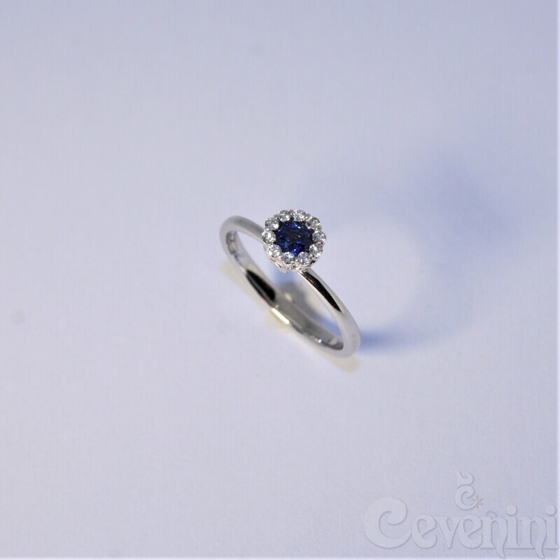 ANELLO SNODATO CEVENINI UNIQUE ORO BIANCO 750‰ CON DIAMANTI E ZAFFIRO TAGLIO ROTONDO