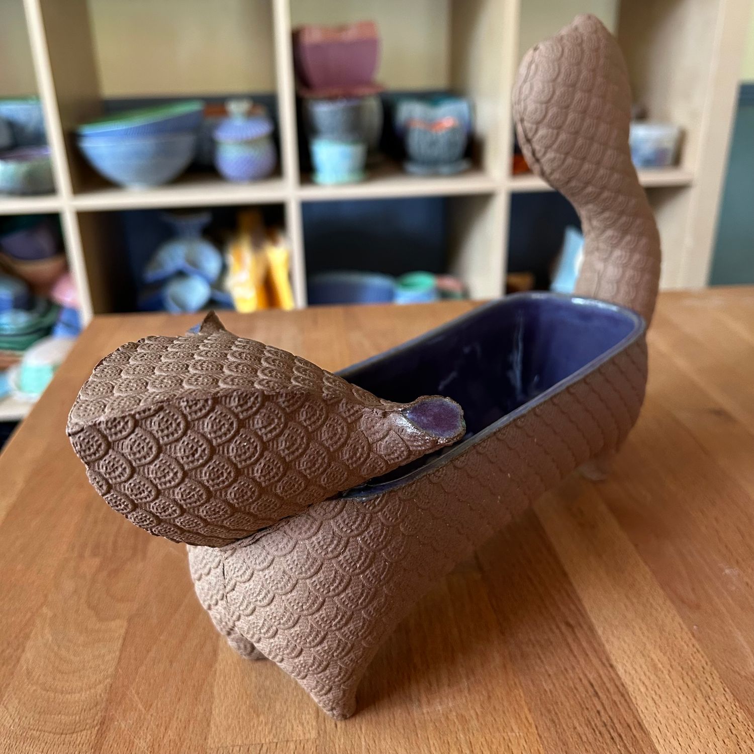 Medium Brown Squirrel with purple glaze inside