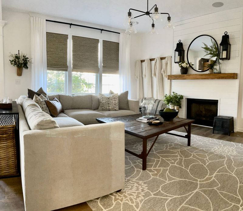 neutral sectional sofa with accent pillows in cozy living room