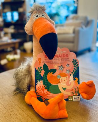 Flamingo Friend & Mermaid Magic Gift Set Plush flamingo holding a Petit Collage mermaid coloring book and sticker set, perfect gift for girls ages 4 to 7