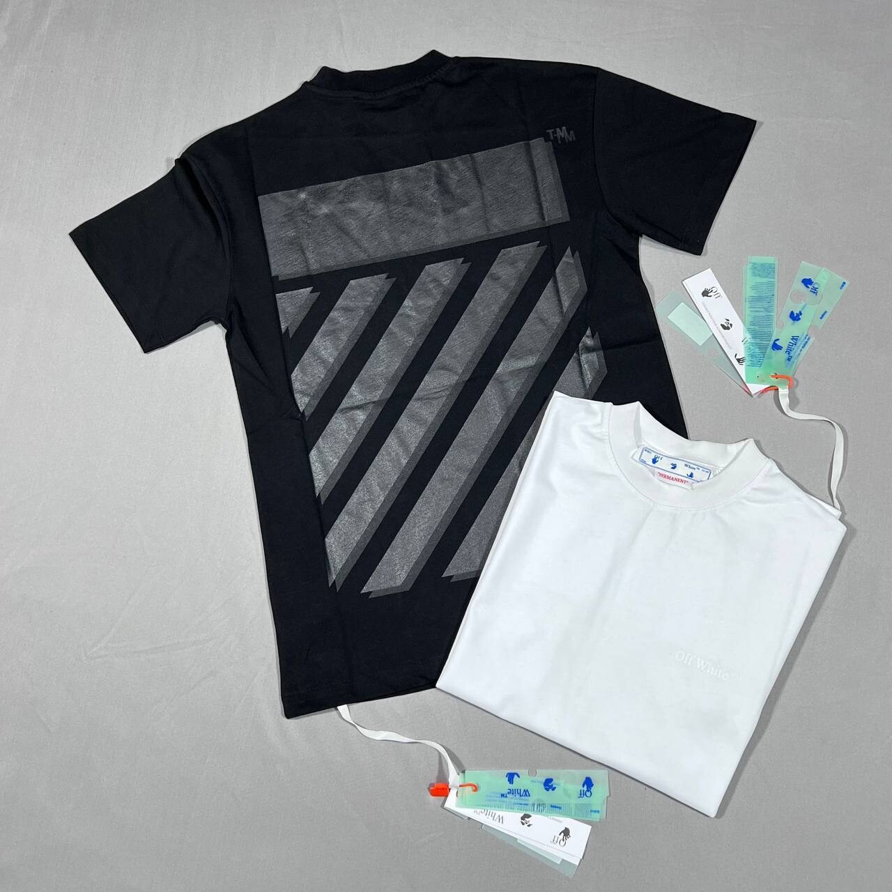 Off-White Men's Women's Tshirts Replica Cotton T-shirts Faded Effect First Copy Logo Tshirt Off White Rubber Diagonal Stripes T Shirts Men Women Diag Slim Rep T-shirt Black Reps Tee Shirt Fake Sale UK
