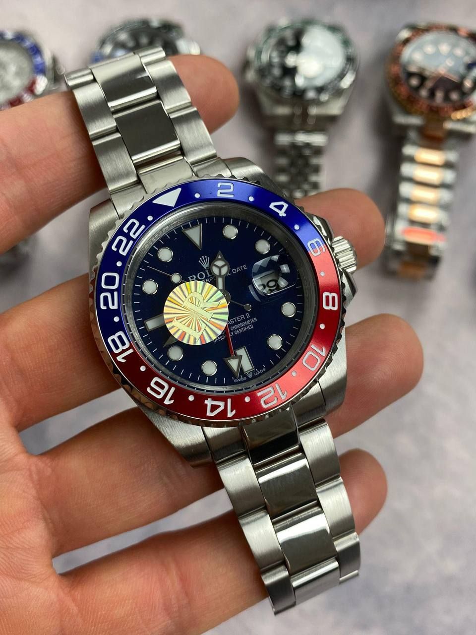 Rolex GMT Master II Black Dial Watch in Silver Chain Strap with Red/Blue Bezel