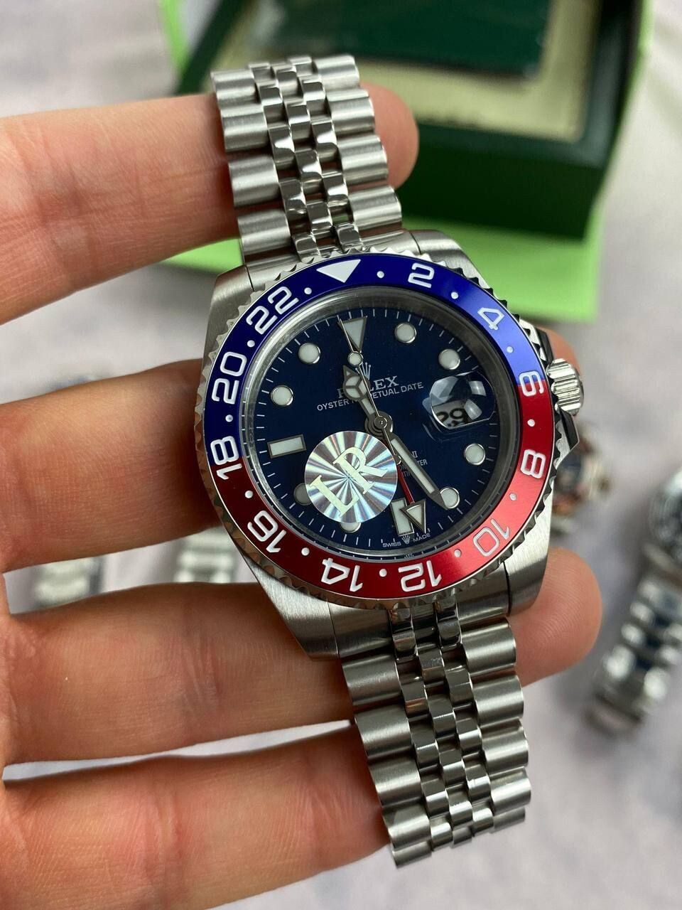 Rolex GMT Master II Black Dial Watch in Silver Chain Strap with Red/Blue Bezel
