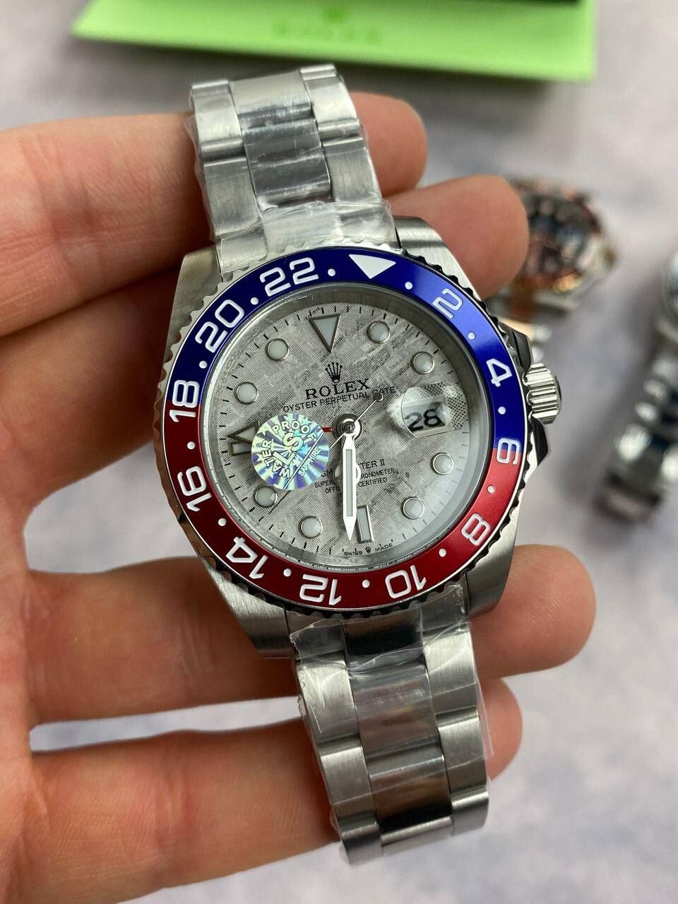 Rolex GMT Master II White Dial Watch in Silver Chain Strap with Red/Blue Bezel