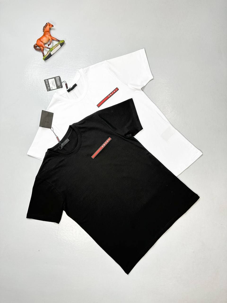 Prada Milano Men's Women's Designer Black White T-shirts Reps AAA Sale UK Men Women First Copy Replica T-shirt Man Woman Fake Rep Tee Shirt 1st Copies Cheap Price Luxury T Shirts 1:1 Brand Logo 1 to 1 Tshirts Fakes Crewneck Tshirt Duplicate