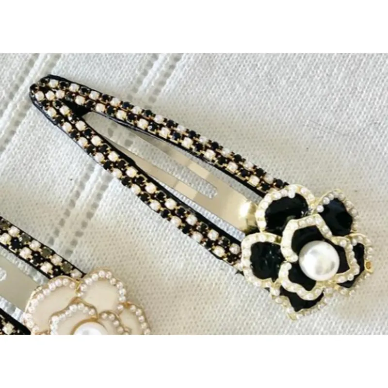 SNAP HAIRCLIP BLACK PEARL TRIM / 107HC025