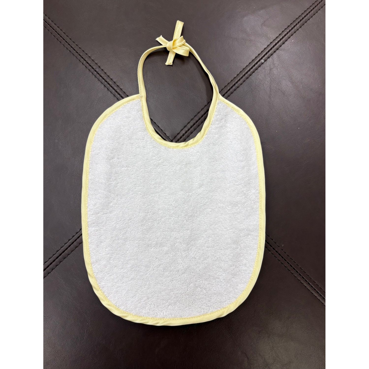 WHITE TERRY BIB ASSORTED COLORED EDGING