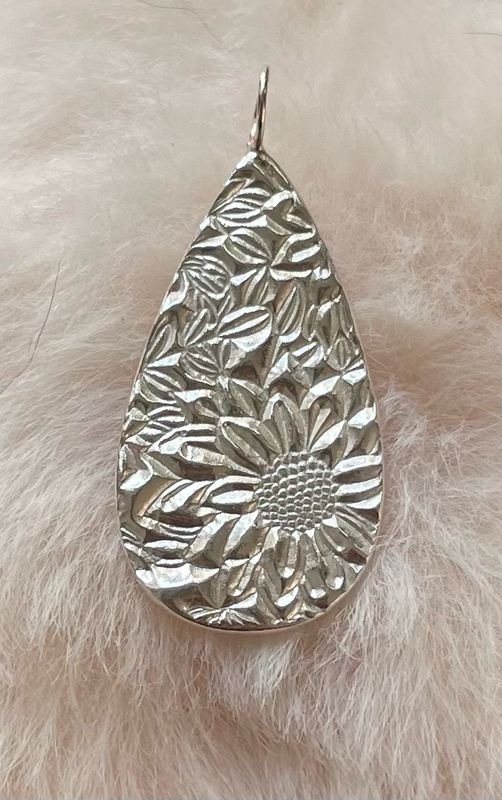 Teardrop shaped sunflower pendant