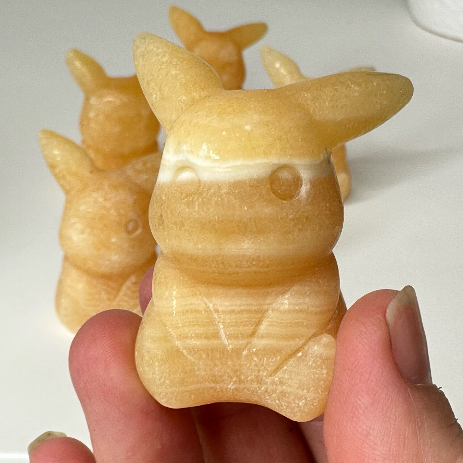 Honey Calcite Pika Carving