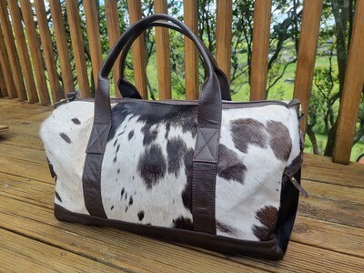 Brown and White Cowhide Travel Bag