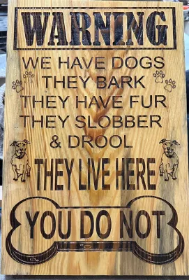 Warning dogs live here sign