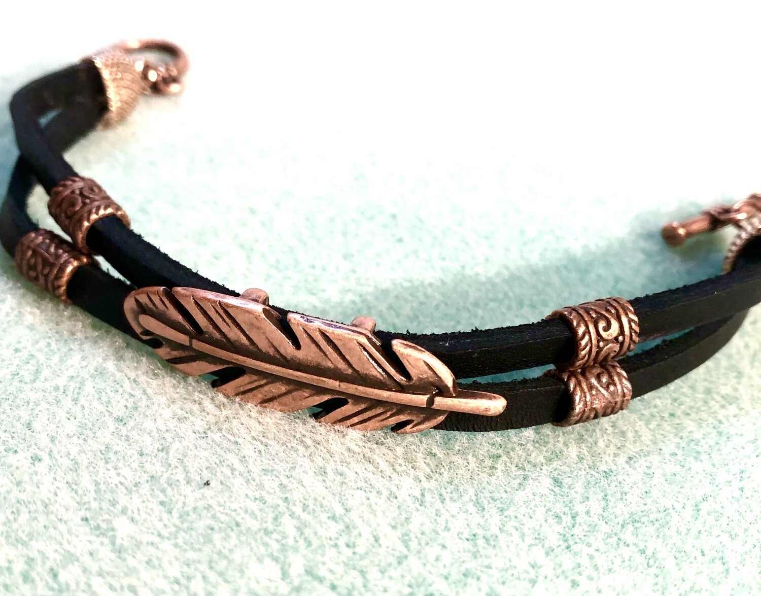 Unisex Bracelet - Copper Feather on Double Black Leather Cord