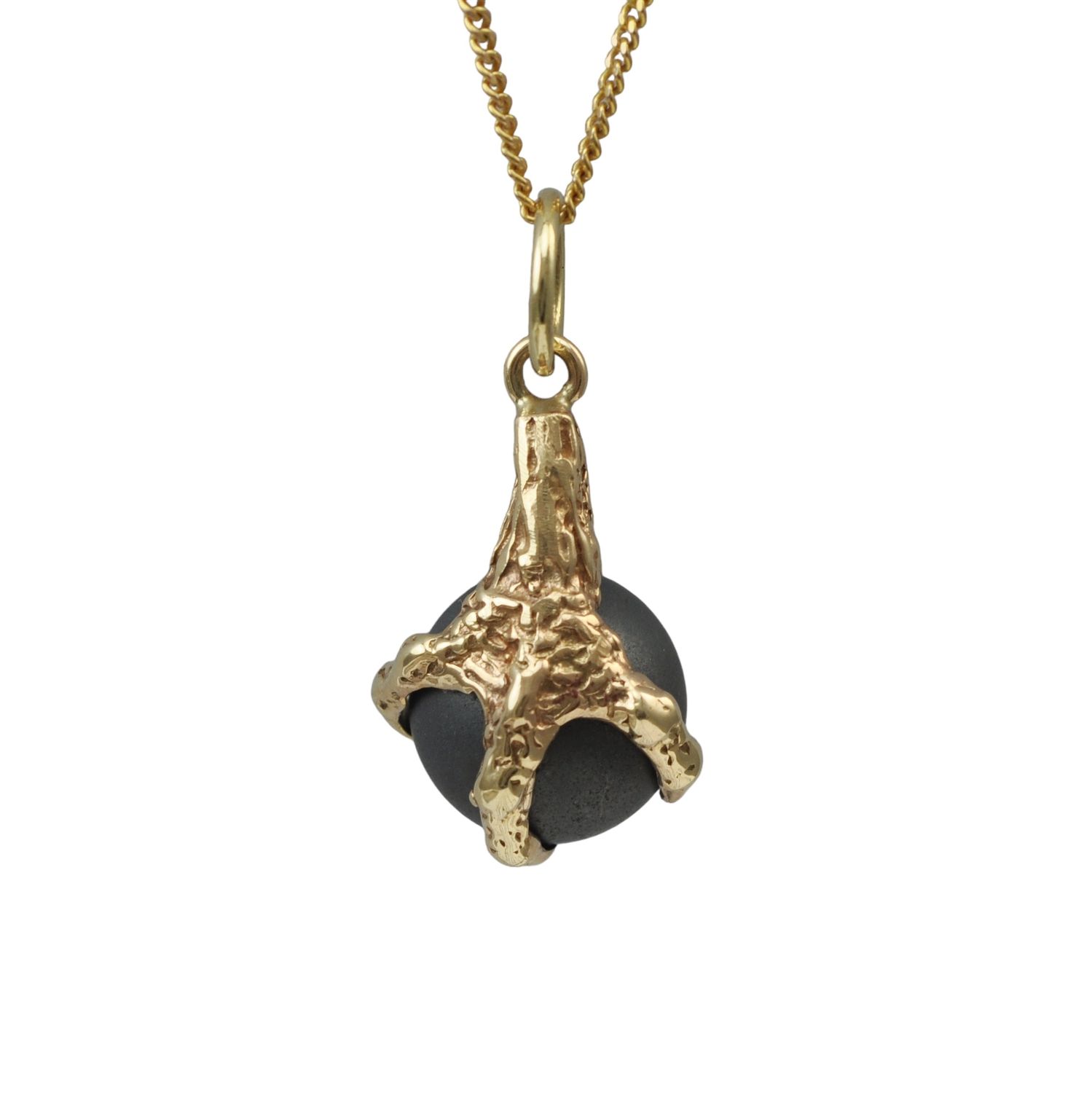Vintage dark hard stone claw pendant