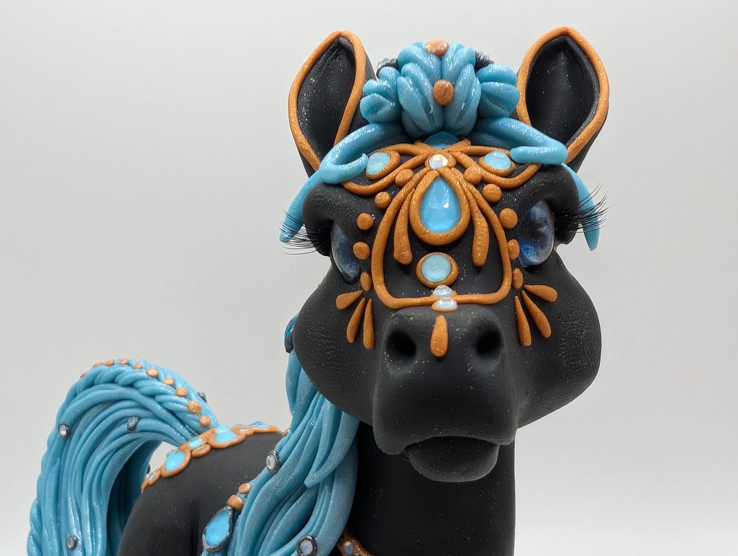 Chunky Pony with aqua and gold decorations