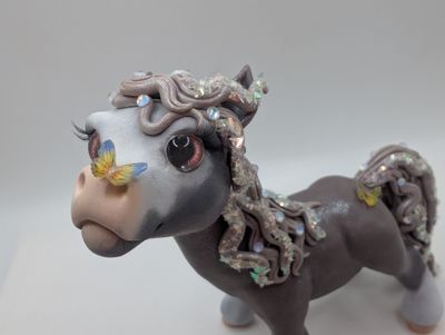 Grey Chunky Pony with Butterflies