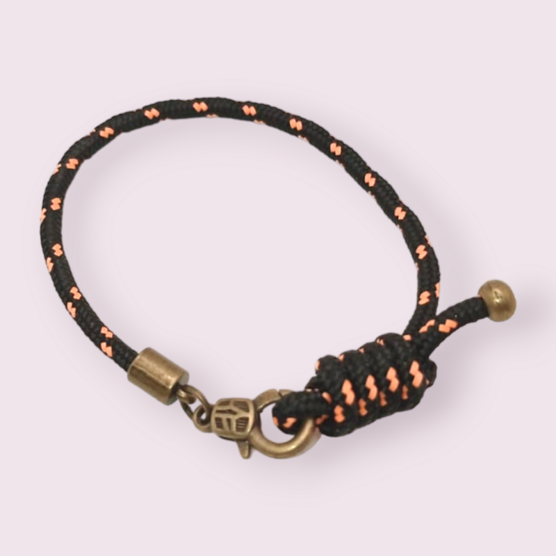 Pulsera náutica negra detalle naranja