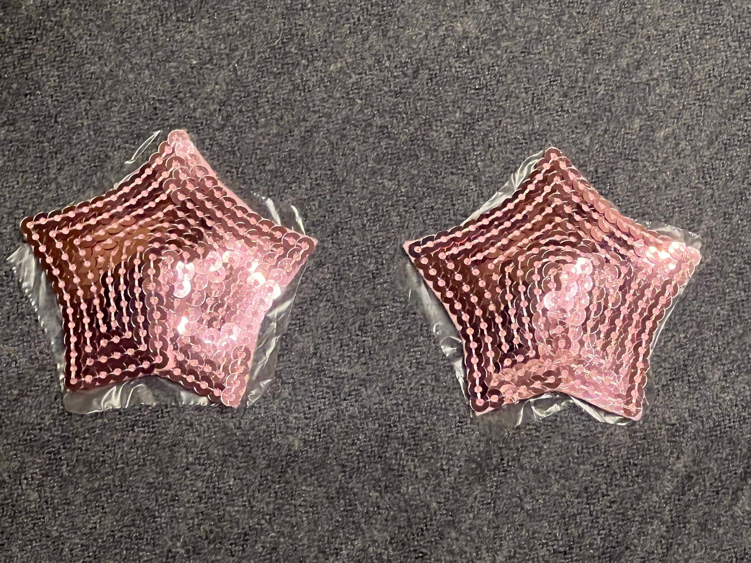 2 pinke Paillettenstern-Nipplepads. Selbstklebend