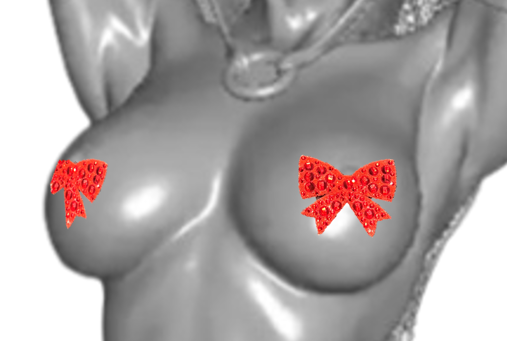 2 rote Schleifen-Nipplepads aus Gummi und mit Glassteinen.