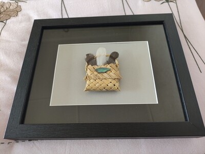 Kete with feathers &amp; paua