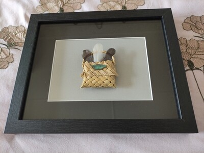 Kete with feathers &amp; paua