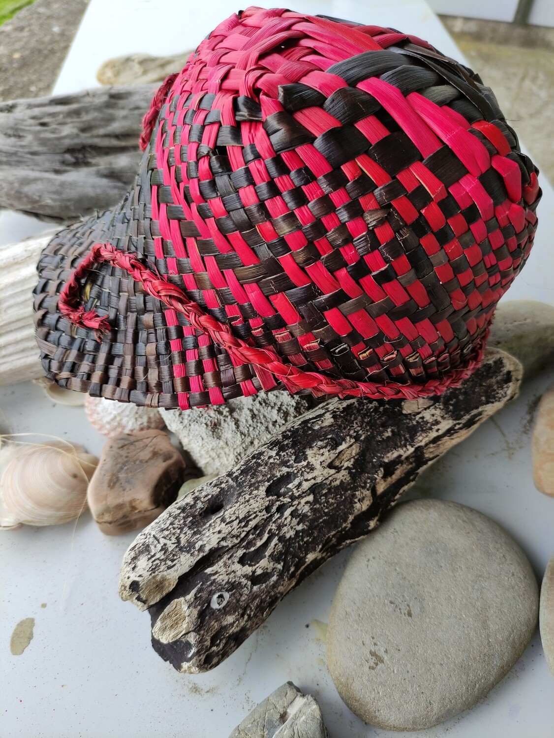 Red &amp; dark brown cap with koru pattern