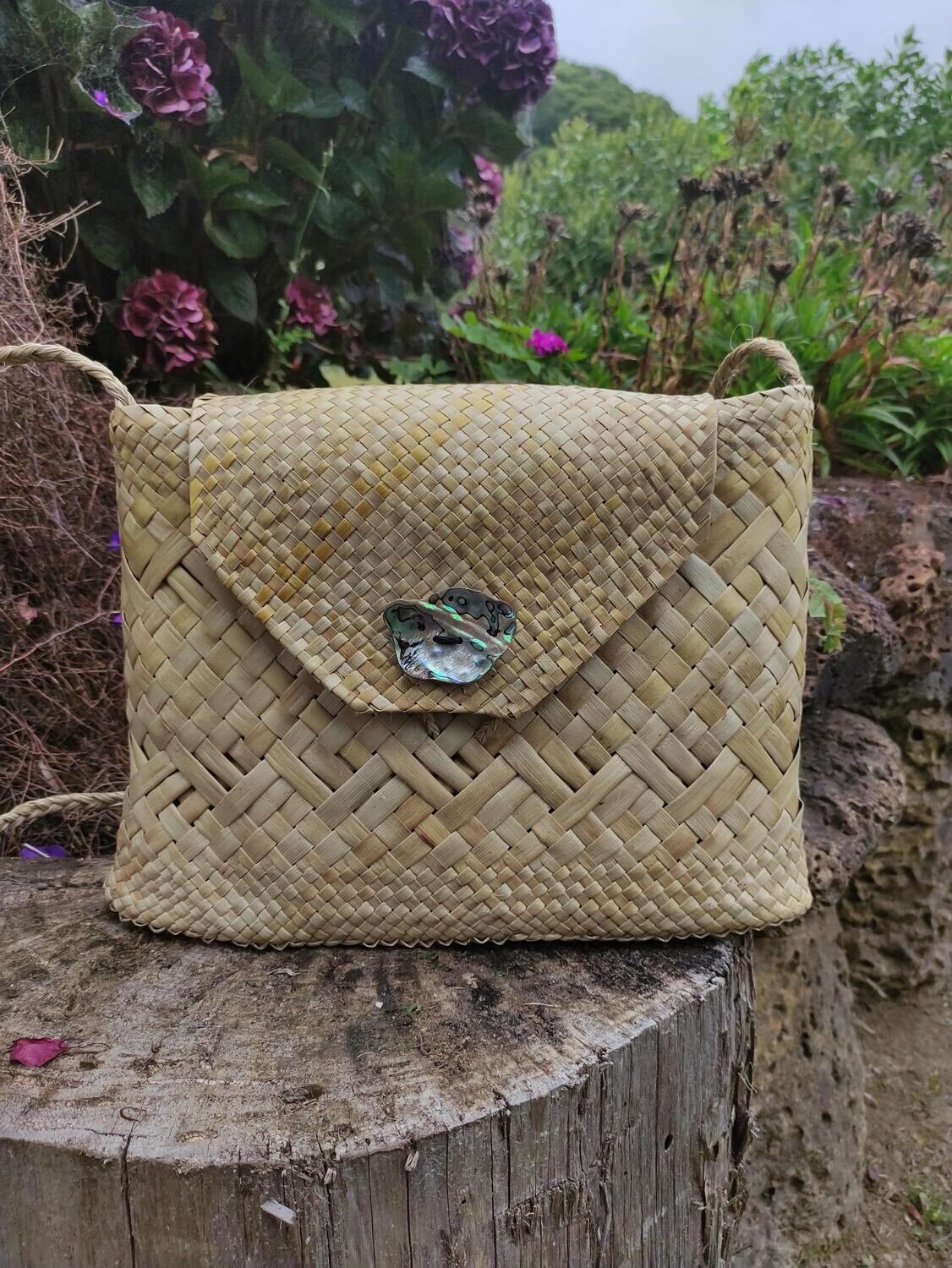 Natural harakeke kete with closing flap