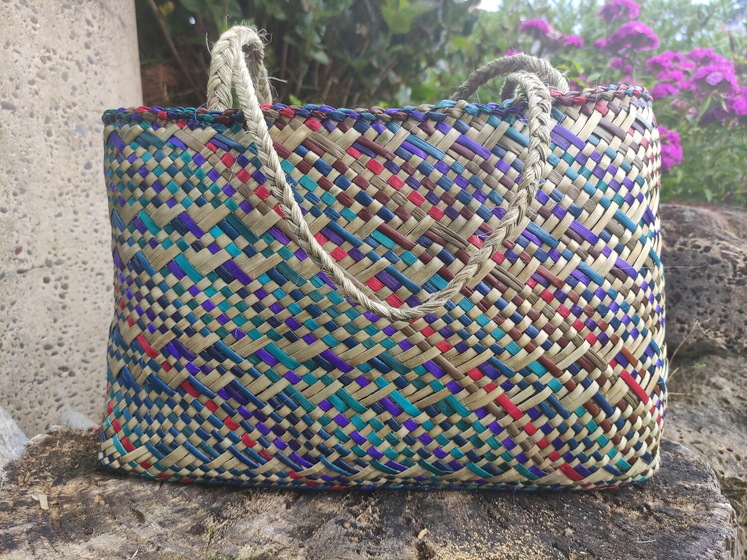 Multi-coloured harakeke kete