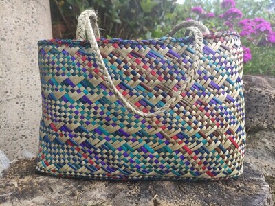 Multi-coloured harakeke kete