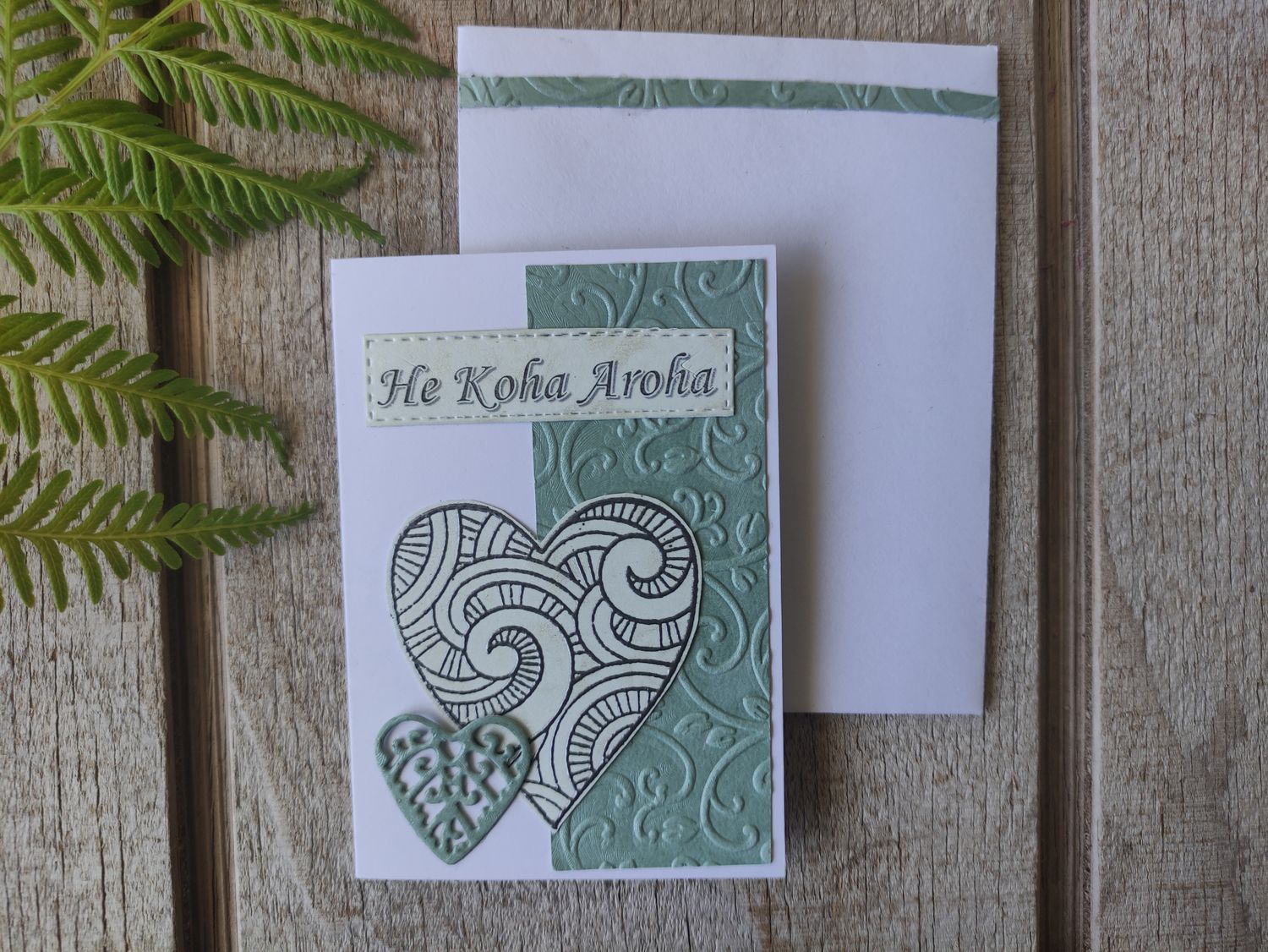 White &amp; light green embossed &quot;He Koha Aroha&quot; Mini Card