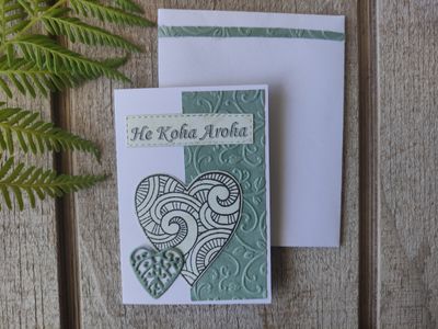 White &amp; light green embossed &quot;He Koha Aroha&quot; Mini Card