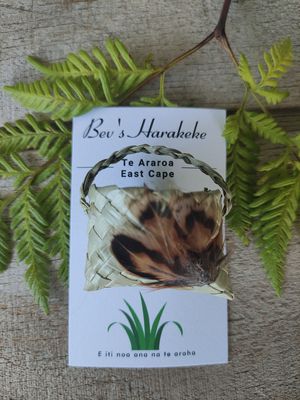 Natural harakeke kete brooch with feathers