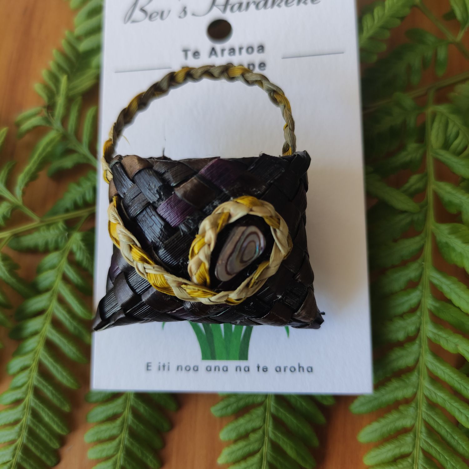 Dark brown/purple kete brooch, natural handle &amp; paua shell