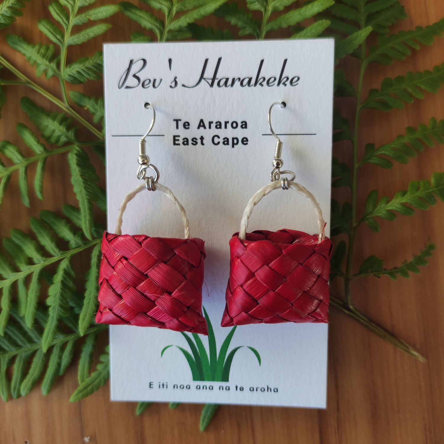 Red mini-kete earrings with muka handles