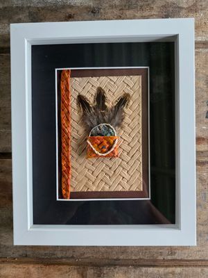 Orange mini-kete with feathers &amp; paua