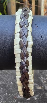 Natural toned harakeke bangle with chocolate brown overlay