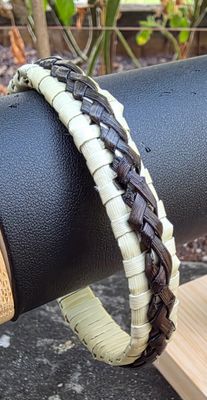 Natural toned harakeke bangle with chocolate brown overlay