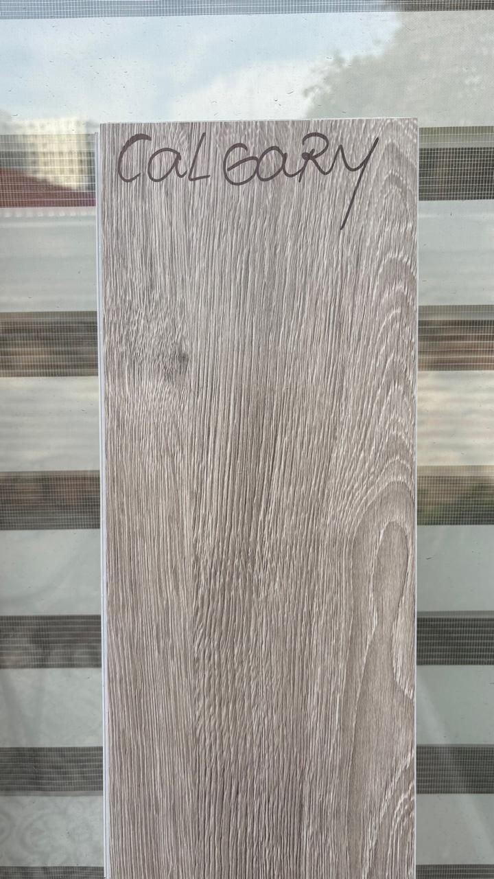 $16.990 M2 SPC CALGARY 5.5 MM  18.6 CM X  1.22 MT CAJA 2,24 M2