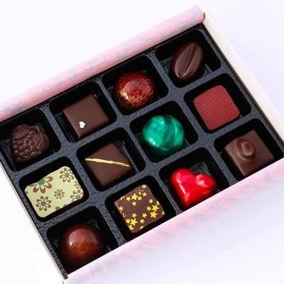 Gift box of 12 Artisan Chocolates - beautiful handmade chocolates made with only the best chocolate and fillings - no preservatives, so flavours are vibrant and real - packaged in an eco-friendly box