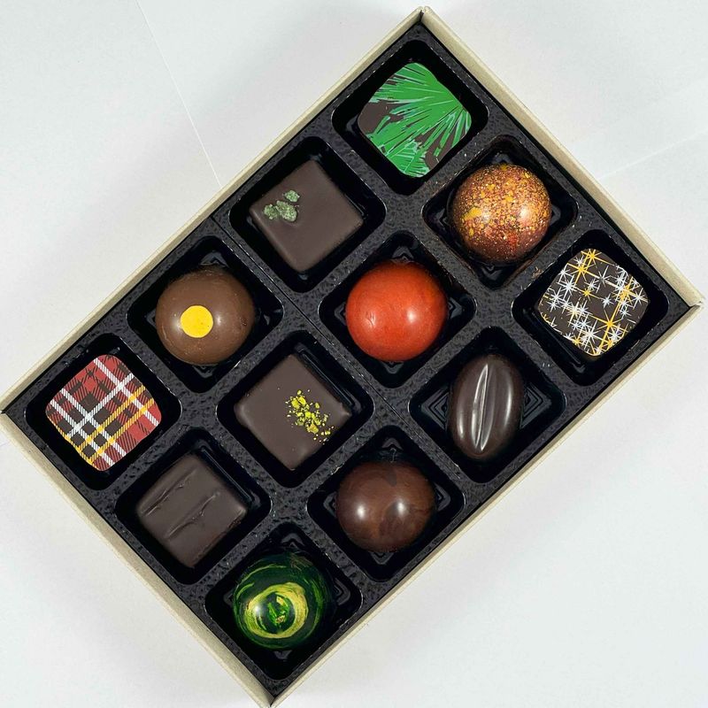 Gift box of 12 Artisan Chocolates - beautiful handmade chocolates made with only the best chocolate and fillings - no preservatives, so flavours are vibrant and real - packaged in an eco-friendly box Gift box of 12 Artisan Chocolates - beautiful handmade chocolates made with only the best chocolate and fillings - no preservatives, so flavours are vibrant and real - packaged in an eco-friendly box