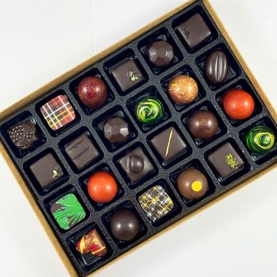 Gift Box of 24 beautiful artisan chocolates, Made with only the best chocolate and fillings - no preservatives so flavours are vibrant. Gift Box of 24 beautiful artisan chocolates, Made with only the best chocolate and fillings - no preservatives so flavours are vibrant.