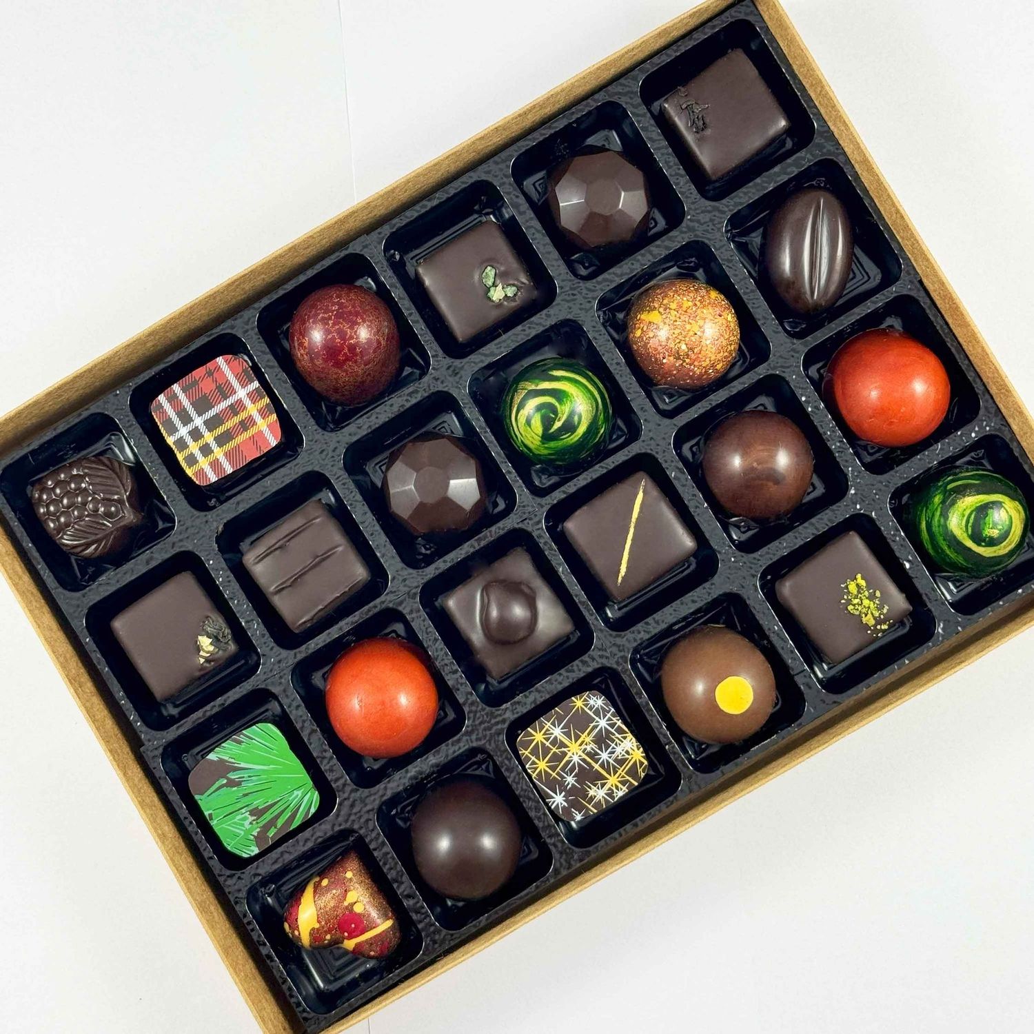 Corporate Gift Box of 24 beautiful artisan chocolates. Made with only the best chocolate and fillings - no preservatives so flavours are vibrant. Corporate Gift Box of 24 beautiful artisan chocolates. Made with only the best chocolate and fillings - no preservatives so flavours are vibrant.