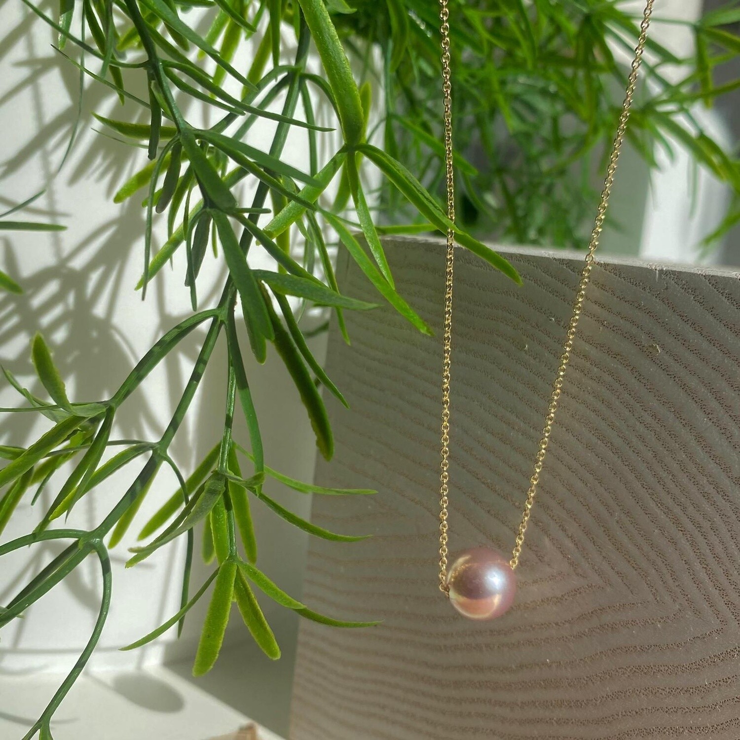 Floating pearl on gold chain