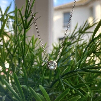 Floating pendant with white topaz