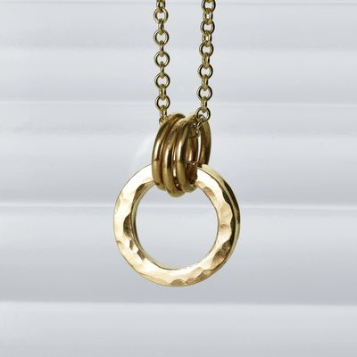 Hammered halo pendant in gold