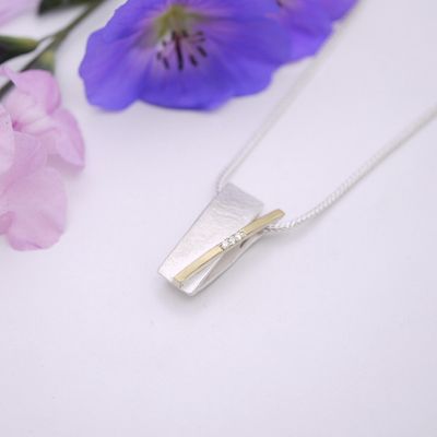 Crossover bar pendant with diamonds